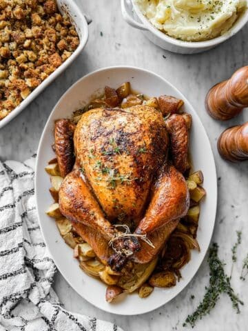 Juicy Roasted Thanksgiving Turkey with Aromatic Carrots, Apples, and Herbs Recipe