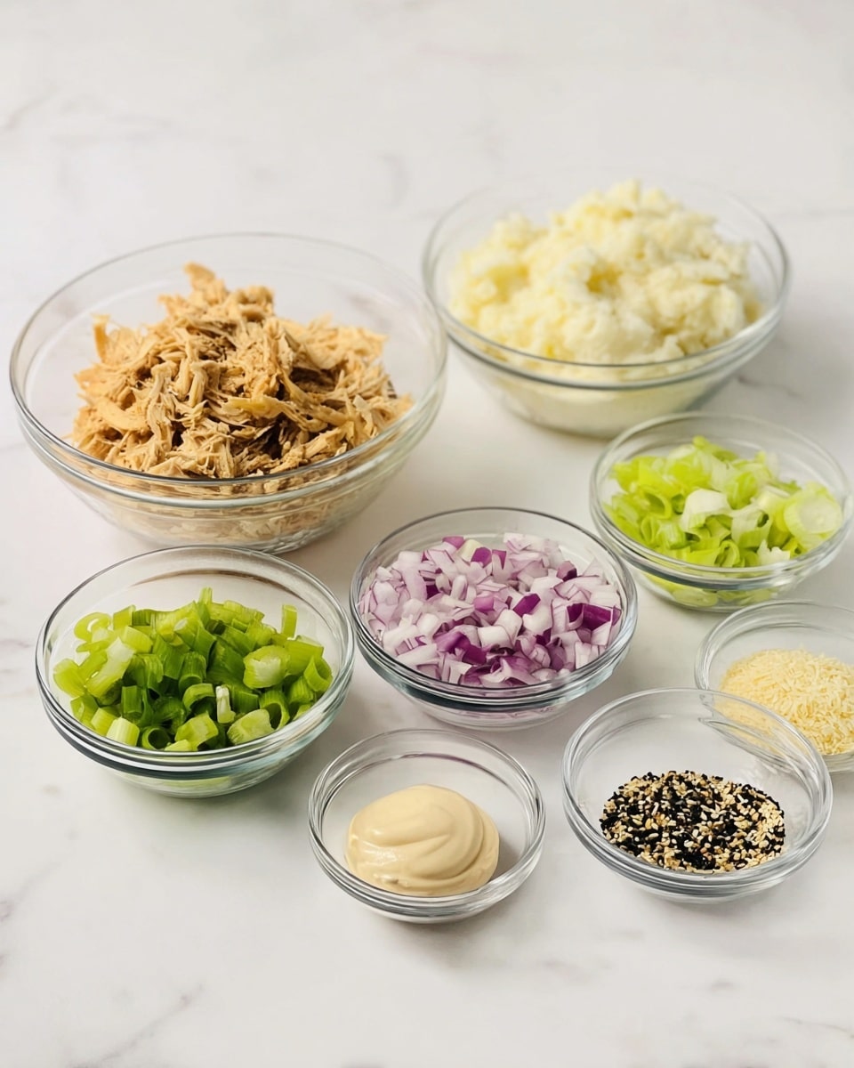 The image shows seven clear glass bowls arranged on a white marbled surface. The biggest bowl at the back left is filled with light brown, shredded pieces of seasoned tofu or a similar textured ingredient. To its right, another large bowl holds a creamy white layer of mashed potatoes or mayonnaise. In front of these two bowls, there are five smaller bowls, each containing finely chopped ingredients: purple chopped onions in the middle, pale green celery pieces to the right, bright green sliced spring onions to the left, a small amount of beige creamy mixture at the front right, and a tiny bowl at the front left with a mix of black and white sesame seeds and small dried seasonings. The bowls are set neatly with soft, natural lighting on a white marbled background. photo taken with an iphone --ar 4:5 --v 7