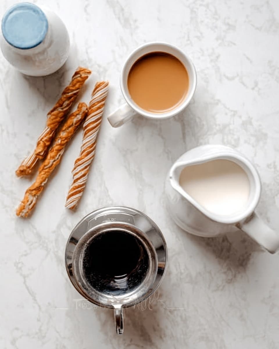 The image shows a white marbled surface with a small white cup filled with light brown coffee at the top center. To the right of the cup is a white pitcher filled with milk, showing a smooth and creamy texture. Below the cup and pitcher is an inverted shiny silver coffee dripper with black inside, giving a reflective look. On the left side, there are three long, spiral wafer sticks with light and dark brown stripes placed side by side. A woman's hand holding a white and light blue ceramic container is visible on the left edge of the image. Photo taken with an iphone --ar 4:5 --v 7