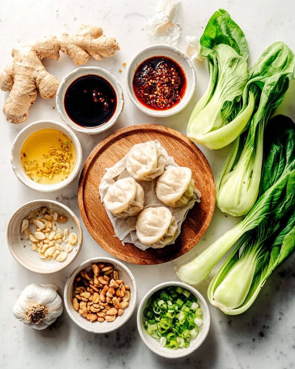 The image shows a white marbled surface with several small white bowls and fresh ingredients. In the center, there is a round wooden plate with two neat piles of pale, soft dumplings. Around the plate, there are bowls with bright red chili oil, dark soy sauce, golden broth, and a mix of toasted nuts and seeds. Fresh green bok choy leaves are placed to the right side, with a bowl of chopped green onions nearby. To the left, there are garlic cloves and a small piece of fresh ginger root. The setup is clean and colorful with natural light highlighting the textures of each ingredient. Photo taken with an iphone --ar 4:5 --v 7