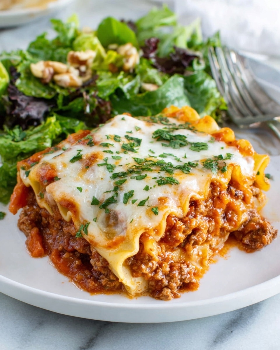 A white plate holds a large piece of lasagna with three visible layers: the bottom layer is a light pasta sheet, the middle layer is a rich reddish-brown meat sauce mixed with bits of orange carrot, and the top layer is melted white cheese with some green parsley sprinkled on it. A silver fork is placed behind the lasagna, and behind the plate is a side of leafy green salad with light brown crunchy pieces. The setting is on a white marbled surface. Photo taken with an iphone --ar 4:5 --v 7