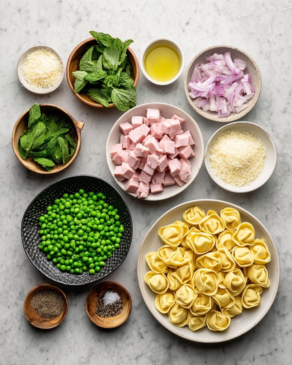 Several small white bowls and one white plate are arranged on a white marbled surface. In the center-right, a white plate holds yellow tortellini pasta pieces, each with a folded and rounded shape. To the left of the pasta is a white bowl filled with pale pink diced ham cubes. Below that is a textured black bowl filled with bright green peas. Moving to the top left, a wooden bowl contains fresh green mint leaves. Next to it is a small white bowl with light beige grated cheese. Above the peas and ham, a small white bowl holds chopped light purple onions, and a small white bowl beside it contains golden yellow olive oil. Below the onions and oil is a small white bowl with chopped light-colored garlic cloves. Two very small wooden bowls near the bottom left hold ground black pepper and salt. The whole setup is viewed from above, showing the different colors and textures clearly. Photo taken with an iphone --ar 4:5 --v 7