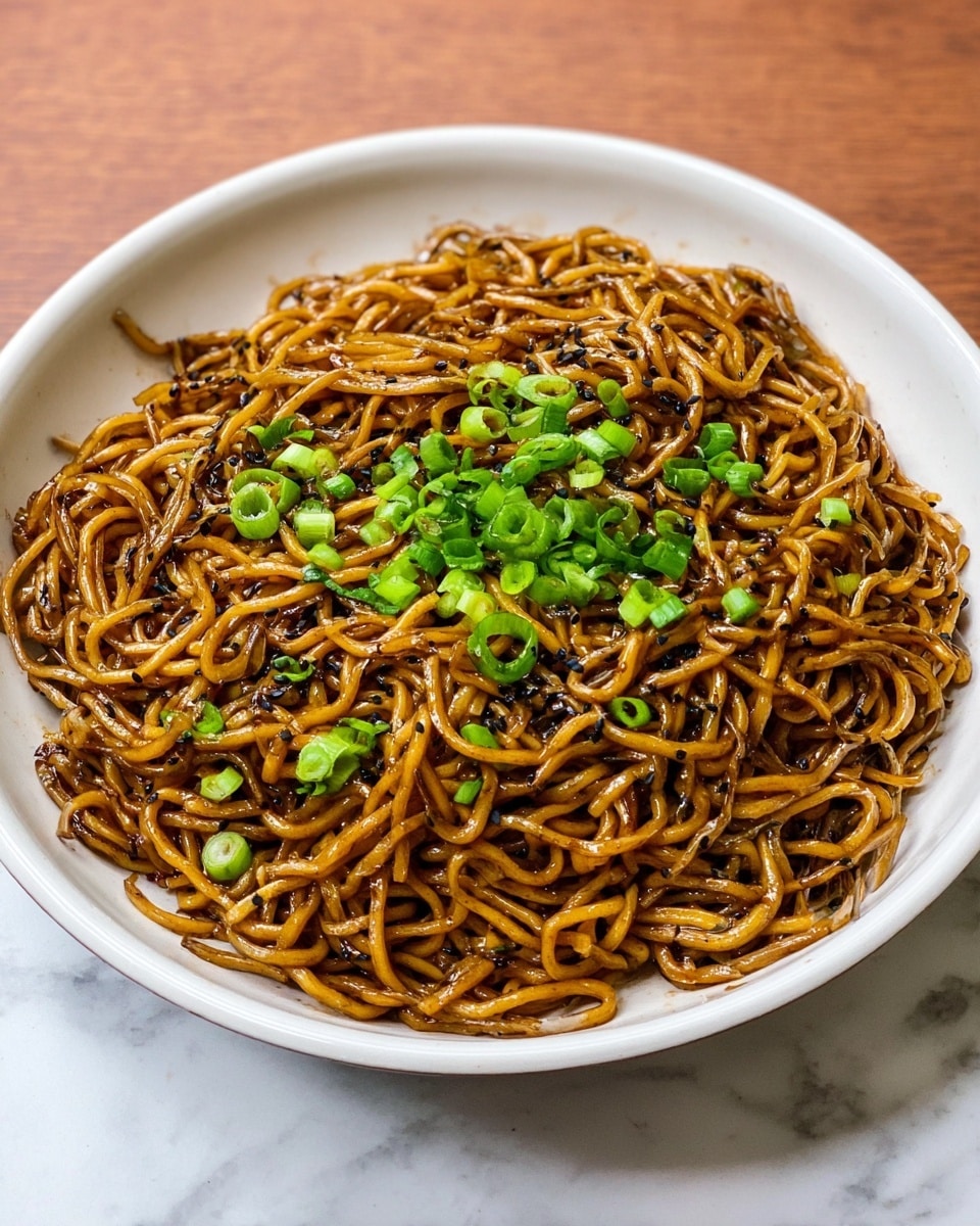 A white bowl filled with thick, pale noodles in light brown broth at the bottom layer. On top of the noodles, there is a large pile of cooked, crumbled brown meat mixed with small pieces of green vegetables. Bright green chopped scallions and small red chili flakes are sprinkled over the meat. A pair of black chopsticks held by a woman's hand is lifting some noodles from the bowl. The bowl sits on a white marbled surface with a small white dish of sauce blurred in the background. Photo taken with an iphone --ar 4:5 --v 7