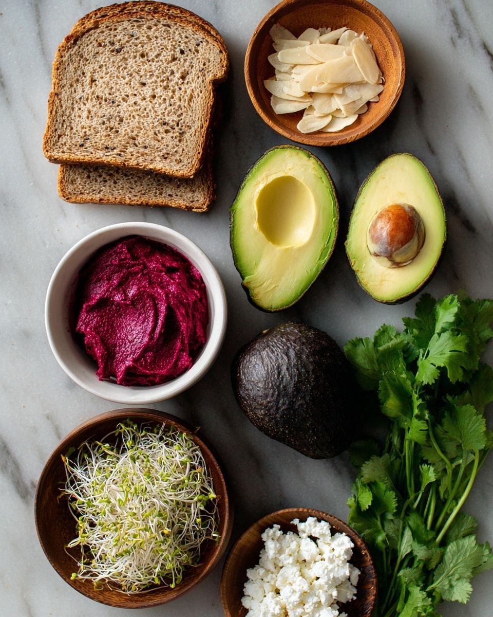 Four slices of whole grain bread are stacked slightly overlapping in the top left. To the right, two halves of a green avocado with one containing a brown seed, and one whole dark-skinned avocado lie nearby. A small wooden bowl at the top holds light beige flakes, and below to the left is a white bowl filled with bright reddish-purple spread with a smooth texture. A wooden bowl filled with green and white sprouts is centered in the lower part of the image, with a small white bowl of white cheese crumbles nearby. Bright green cilantro leaves are at the bottom right, all arranged on a white marbled surface. Photo taken with an iphone --ar 4:5 --v 7